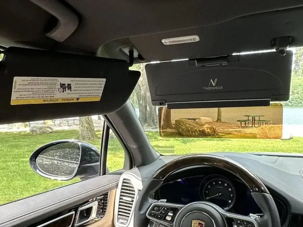 ADDVISOR Plus installed on a windshield, showing front and side sun protection